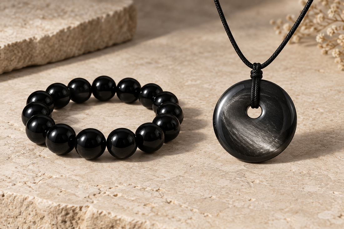 Illustrative dark bracelet and pendant showing different reflections under angled light