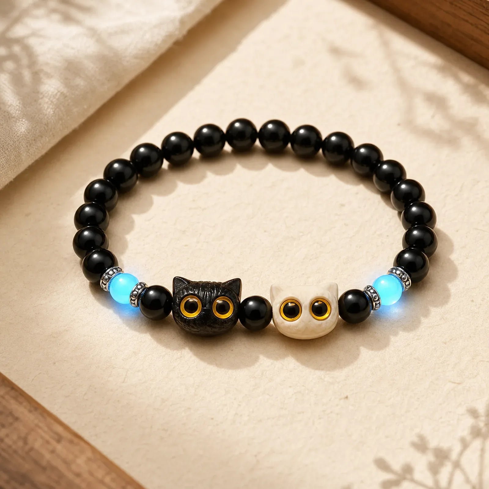 Black Obsidian Hand-Carved Big Eye Cat Relief Bead Bracelet featuring Black Obsidian, Ivory Fruit, Ebony Wood