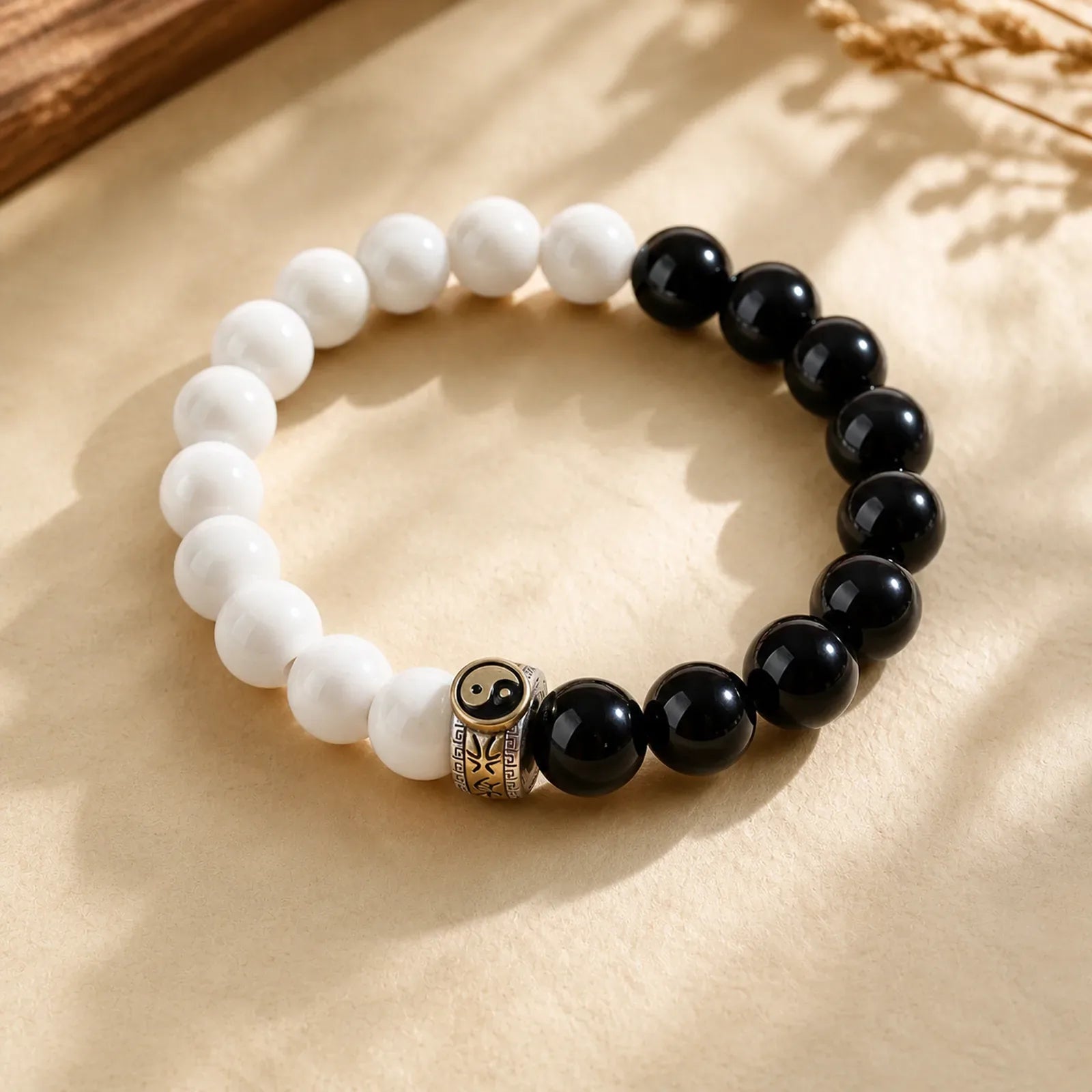 Black Obsidian White Porcelain Beads Yin Yang Fulfilment Bracelet featuring Black Obsidian, White Porcelain, Yin Yang Symbol