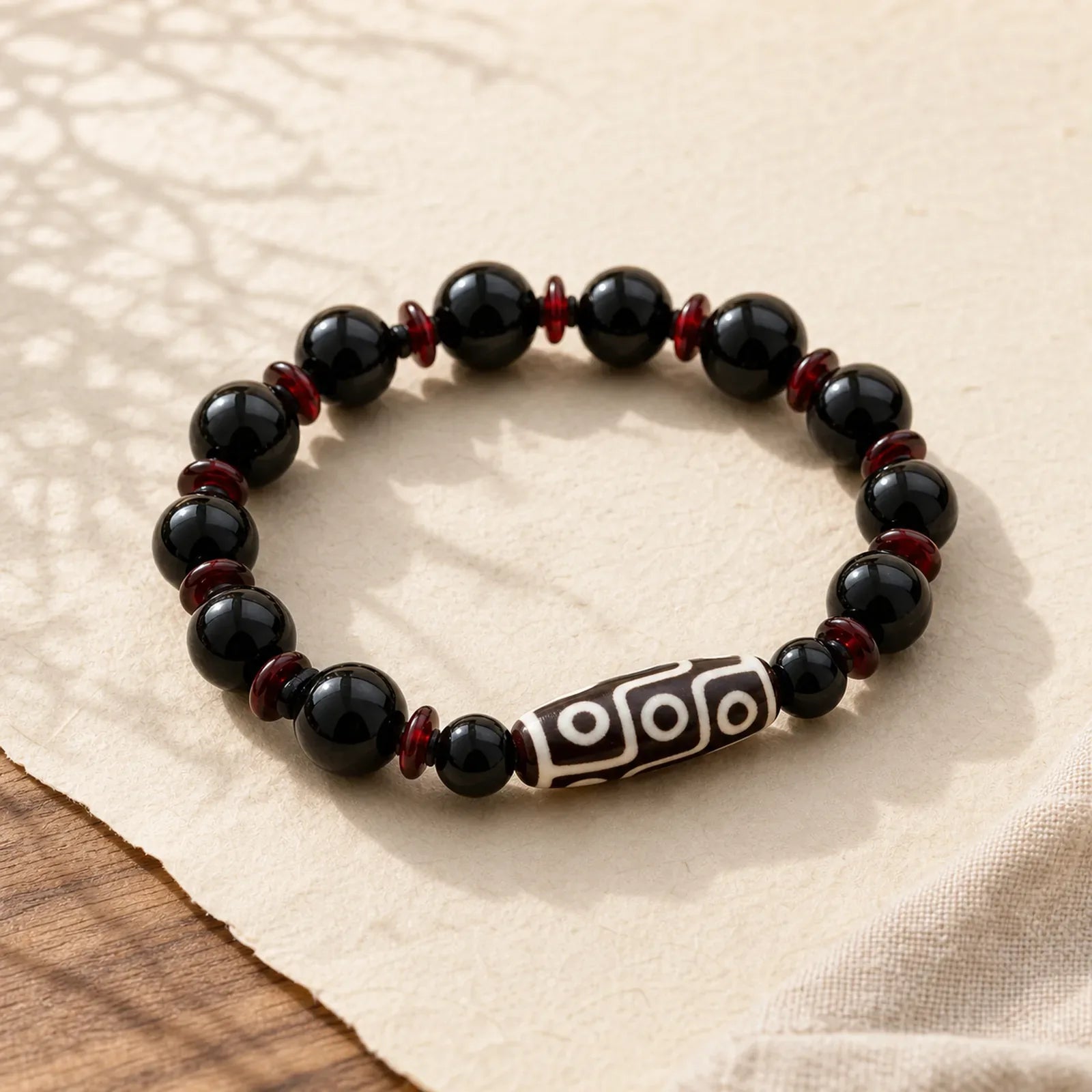 Black Onyx Nine-Eye Dzi Bead Wealth Protection Bracelet featuring Black Onyx, Nine-Eye Dzi Bead, Dzi Bead