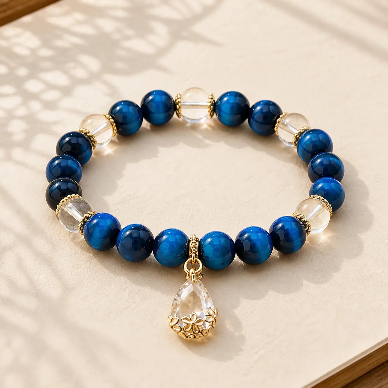 Blue Tiger Eye White Crystal Water Drop Strength Bracelet featuring Blue Tiger Eye, Tiger Eye, Clear Quartz / White Crystal
