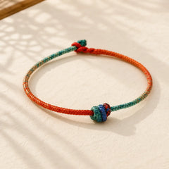 Colored String Hand-woven Knots Strength Bracelet featuring Red String