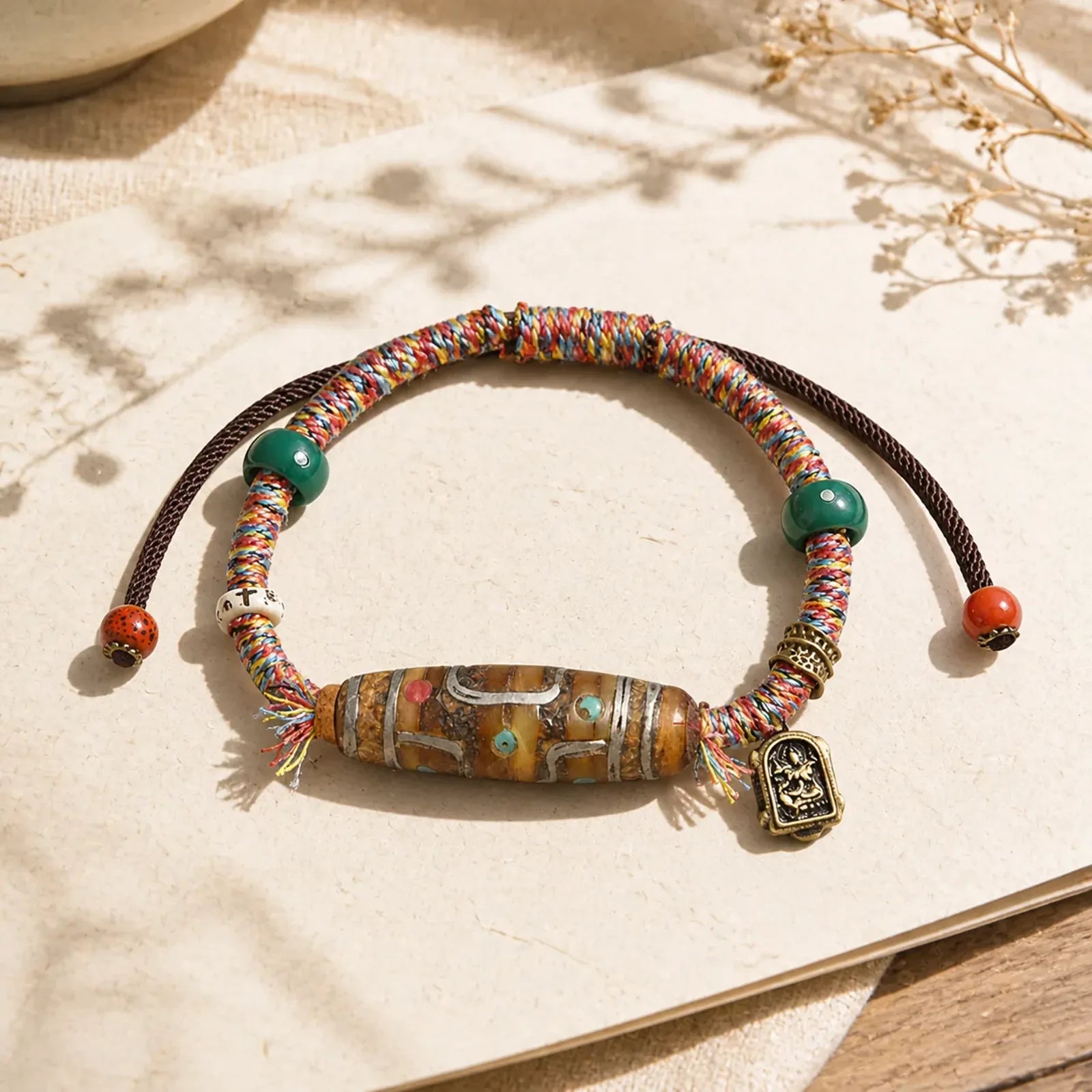 Handcrafted Tibetan Nine-eye Dzi Bead Protection Rope Bracelet featuring Nine-Eye Dzi Bead, Dzi Bead, Red String
