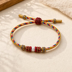 Handmade Dunhuang Color Luck Braid String Bracelet featuring Red String