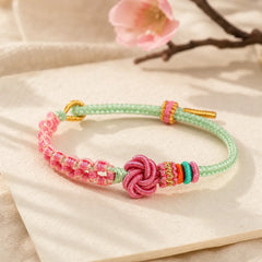 Handmade Pink Green Peach Blossom Knot Braided Bracelet featuring