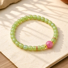 Jade Luck Round Bead Rhodonite Bracelet featuring Jade, Rhodonite, Copper