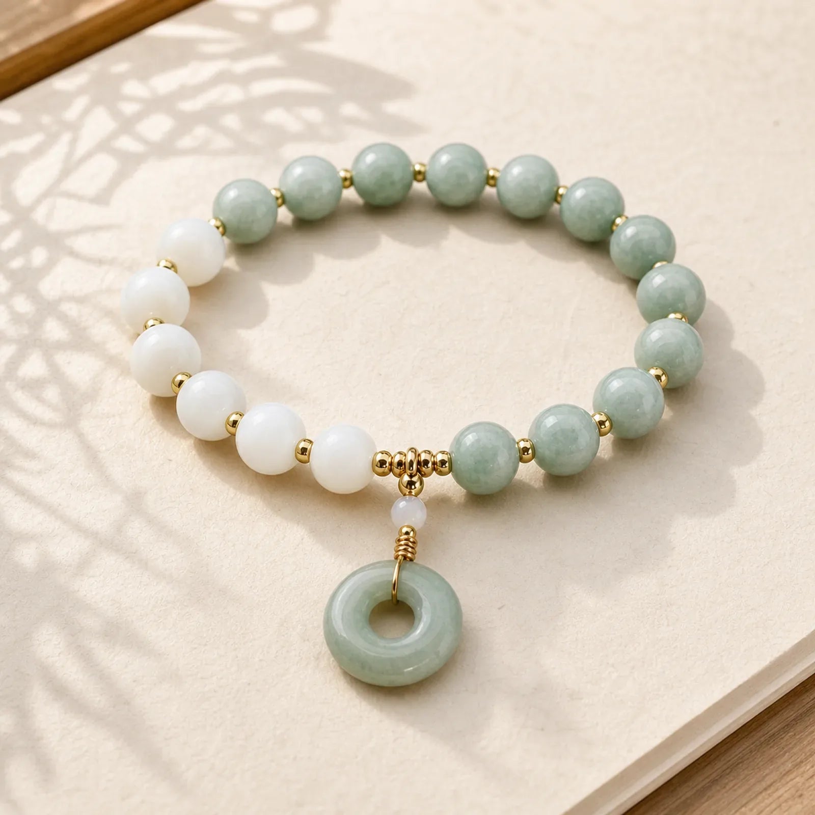 Jade Trochus Horseshoe Snail Peace Buckle Charm Abundance Bracelet featuring Jade, Peace Buckle, Copper