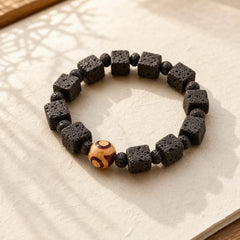 Lava Rock Dzi Bead Healing Bracelet featuring Lava Rock, Dzi Bead, Nine-Eye Dzi Bead