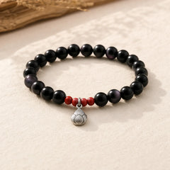 Natural Black Obsidian Cinnabar Lotus Charm Strength Fulfillment Bracelet featuring Black Obsidian, Cinnabar, Lotus
