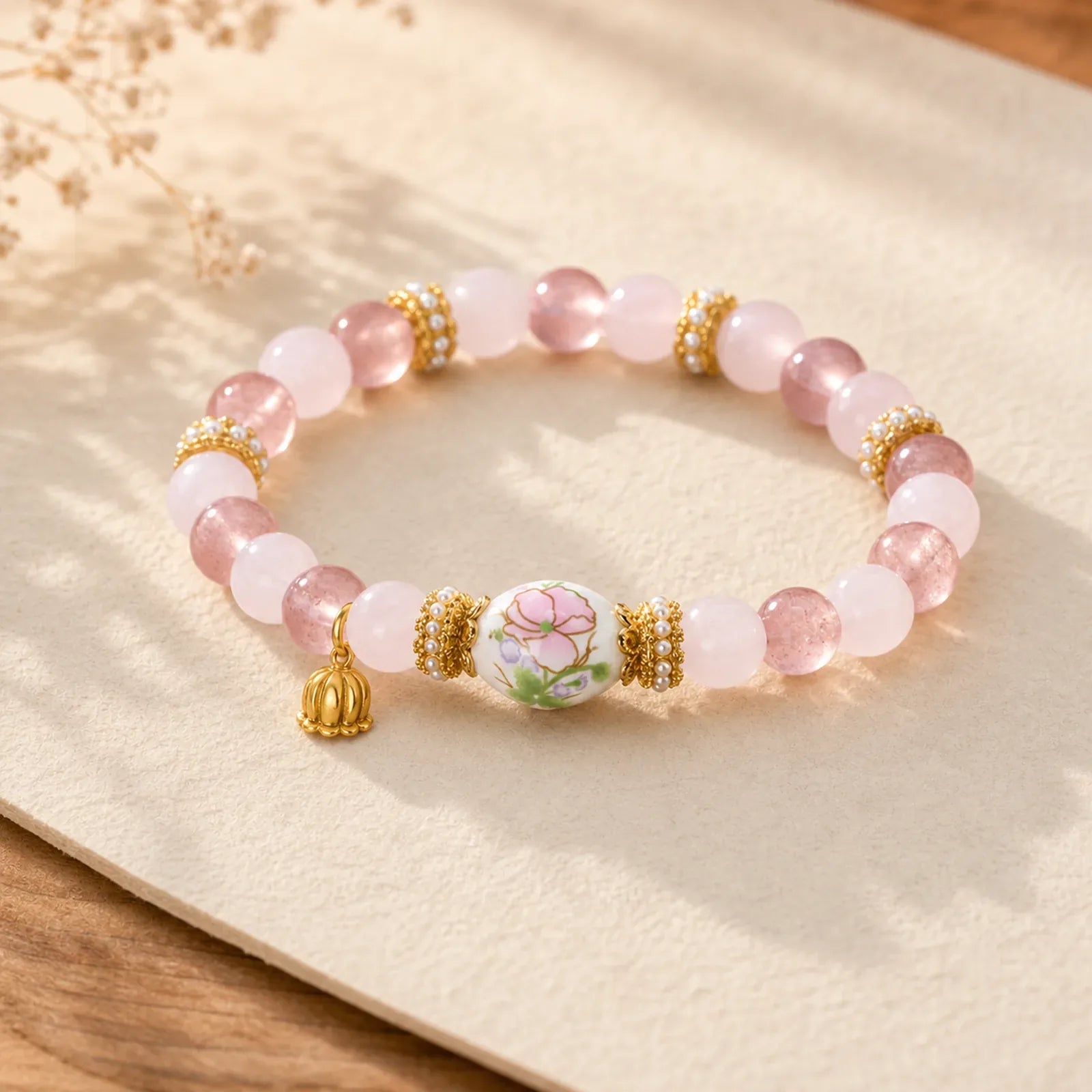 Natural Strawberry Quartz Rose Quartz Ceramic Barrel Bead Lotus Pendant Clarity Round Bead Bracelet featuring Strawberry Quartz, Rose Quartz, Lotus
