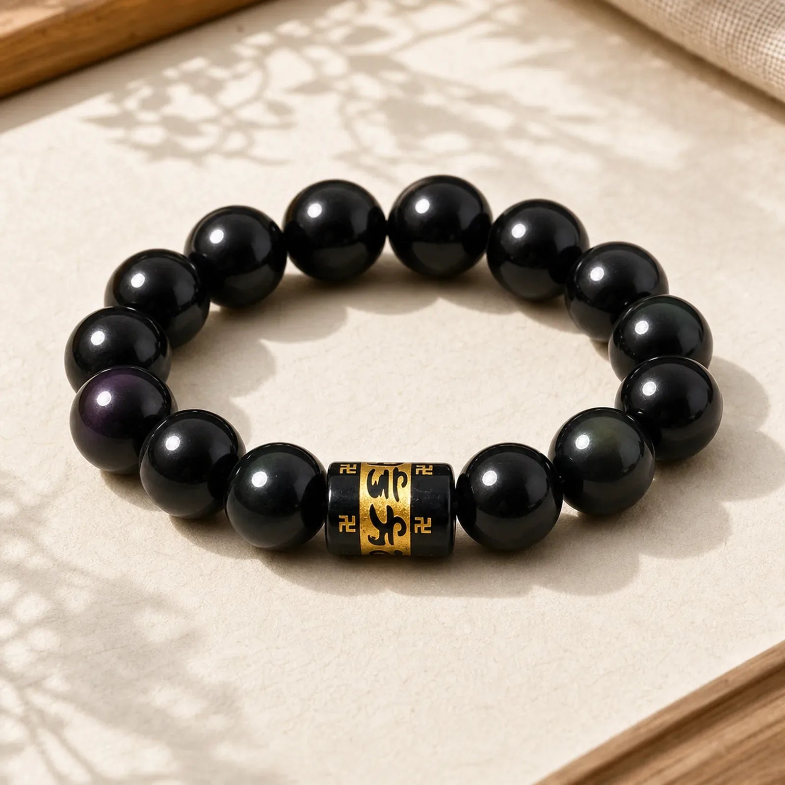 Rainbow Obsidian Om Mani Padme Hum Swastika Positive Bracelet featuring Rainbow Obsidian, Om Mani Padme Hum, Om
