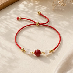 Red Agate Cat Eye Braided String Confidence Bracelet featuring Red Agate, Red String, Copper