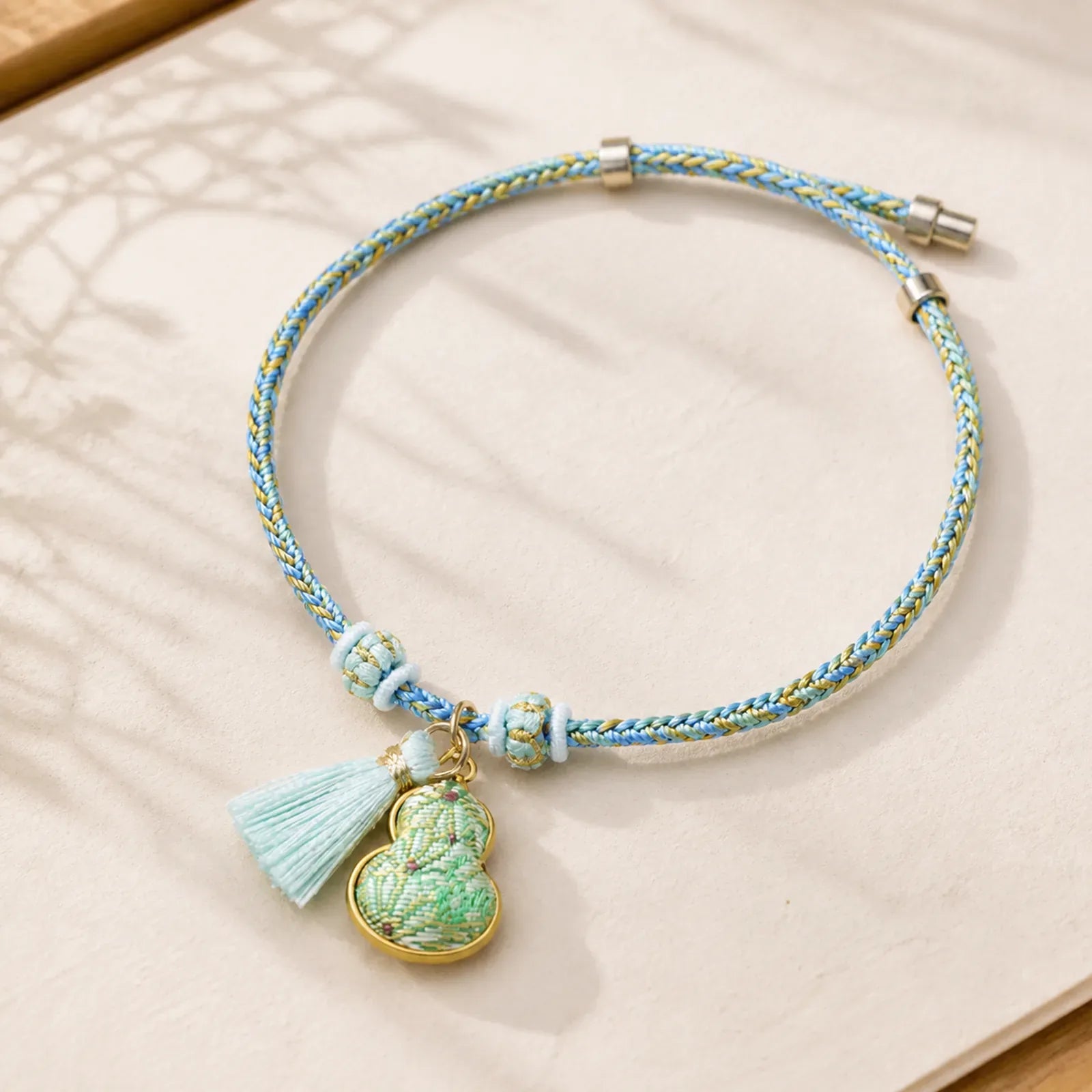 Song Brocade Gourd Luck Tassel Braided Bracelet featuring Red String, Copper