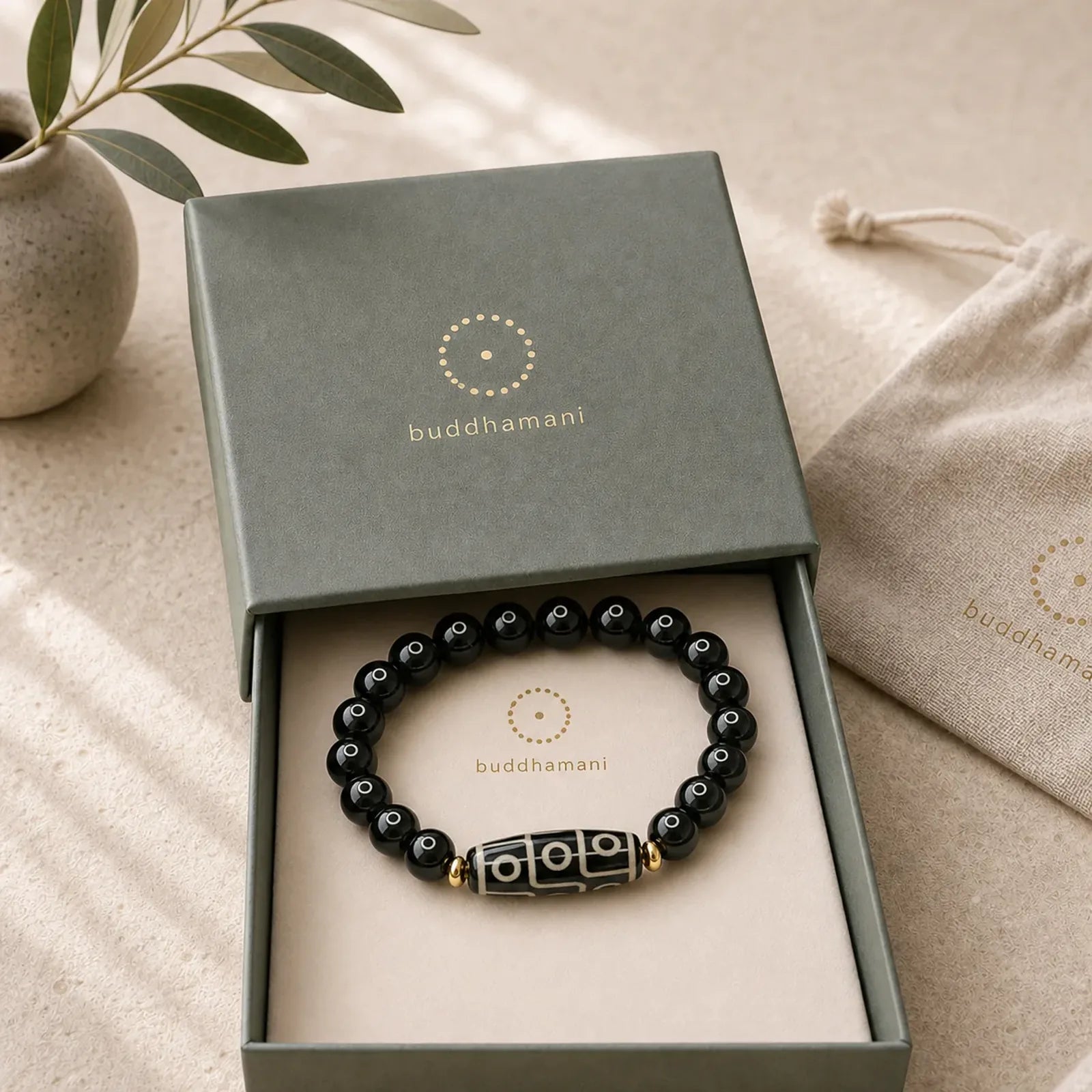 Tibetan Nine-Eye Dzi Bead Black Onyx Power Bracelet featuring Nine-Eye Dzi Bead, Dzi Bead, Black Onyx