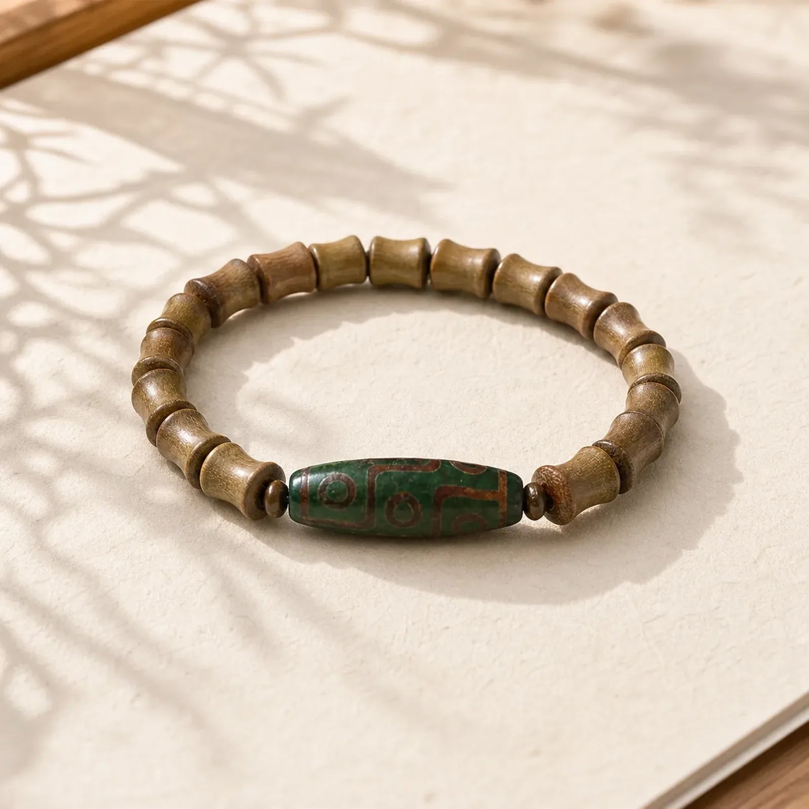 Tibetan Nine-Eye Dzi Bead Green Sandalwood Peace Bracelet featuring Nine-Eye Dzi Bead, Dzi Bead, Green Sandalwood