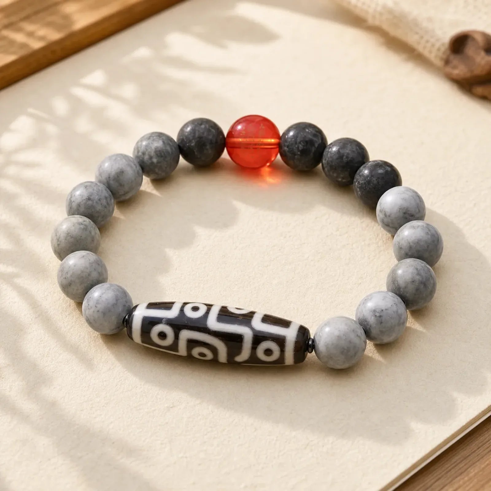 Tibetan Nine-Eye Dzi Bead Picasso Jasper Positive Bracelet featuring Nine-Eye Dzi Bead, Dzi Bead, Picasso Jasper