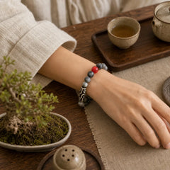 Tibetan Nine-Eye Dzi Bead Picasso Jasper Positive Bracelet featuring Nine-Eye Dzi Bead, Dzi Bead, Picasso Jasper