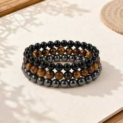 Tiger Eye Hematite Black Onyx Beaded Strength Bracelet featuring Tiger Eye, Hematite, Black Onyx