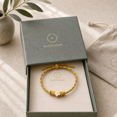 Yellow Braided Rope Flower Rootedness Bracelet featuring Red String