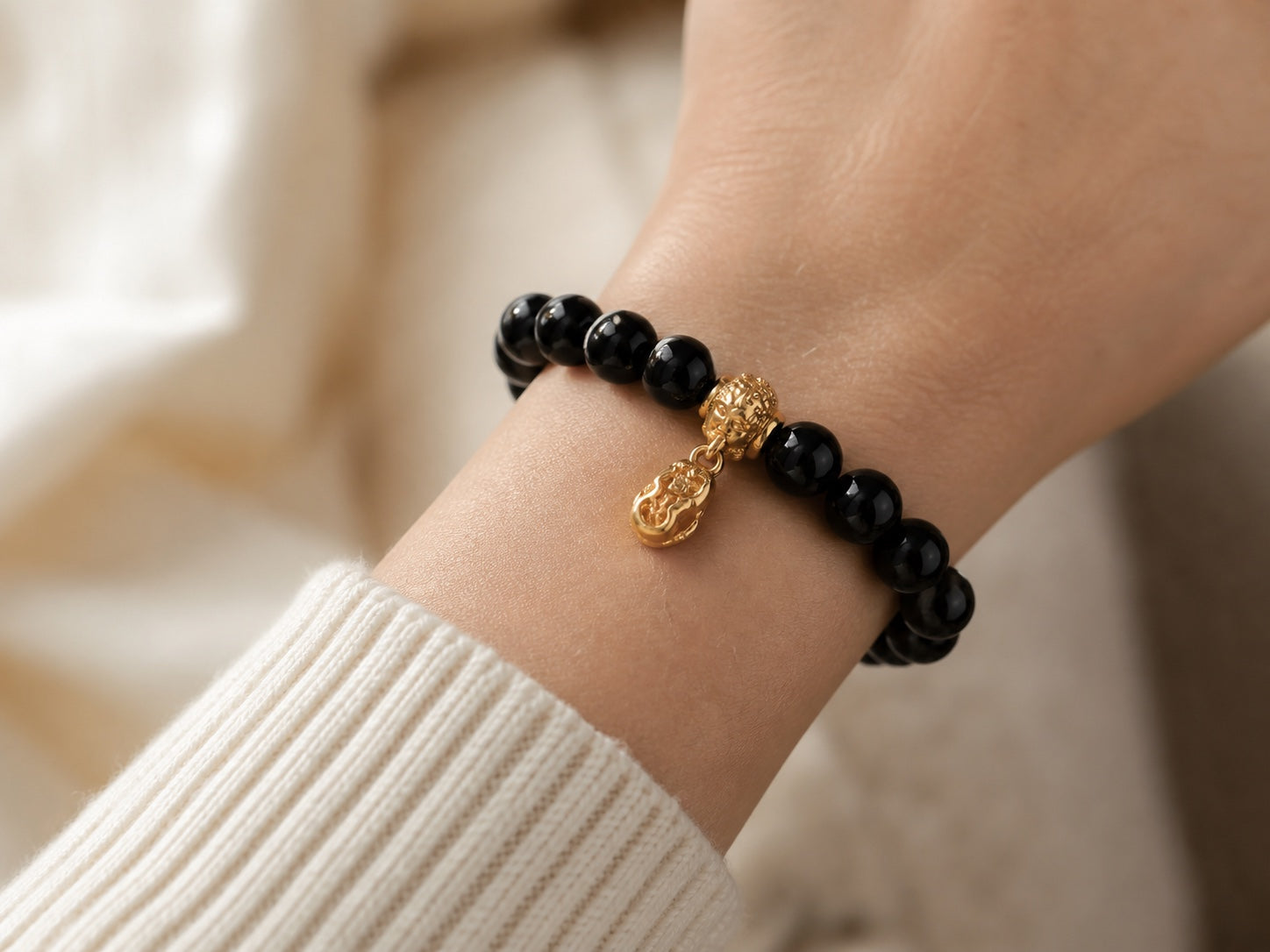 Customer wearing a black obsidian bracelet